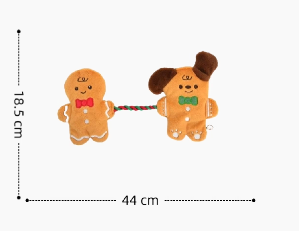 Two gingerbread-themed dog toys on a white background