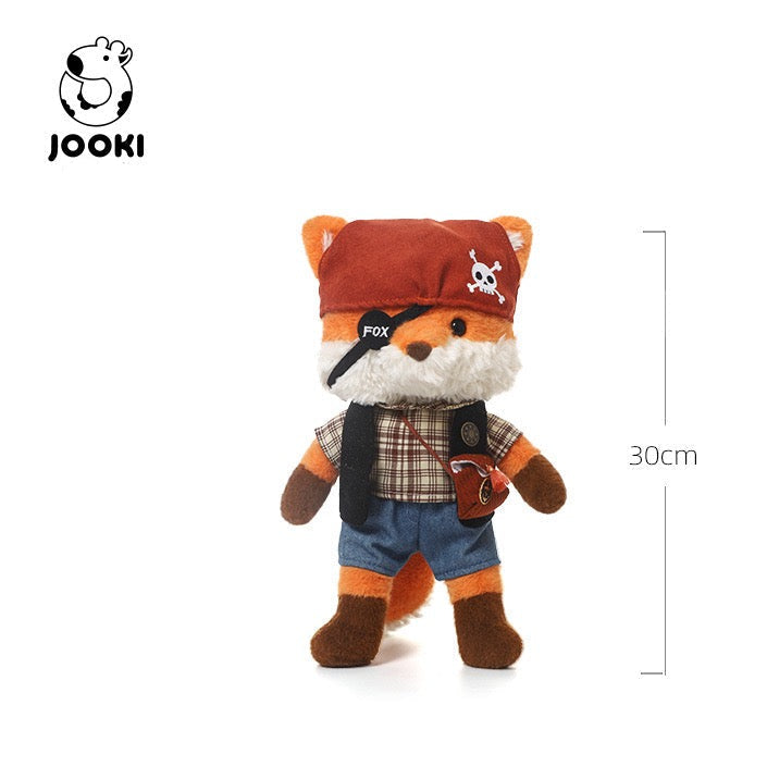 Stuffed toy fox with pirate hat and plaid shirt on a white background, featuring the JOOKI brand.
