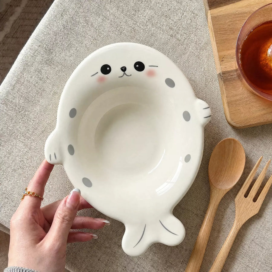 White seal-shaped bowl with cute face and flipper details