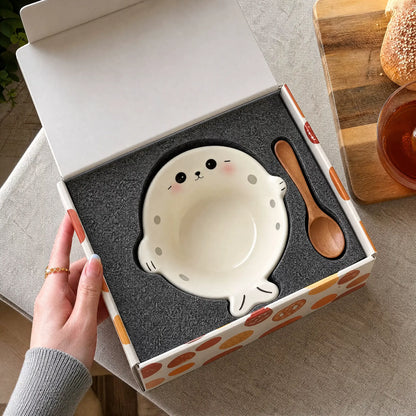 Seal-shaped bowl and wooden spoon presented in gift packaging