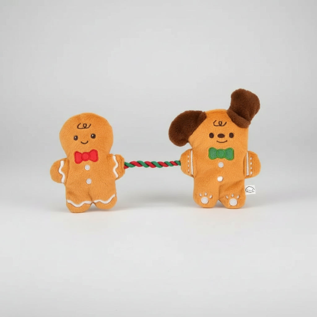 Two gingerbread-themed dog toys on a white background