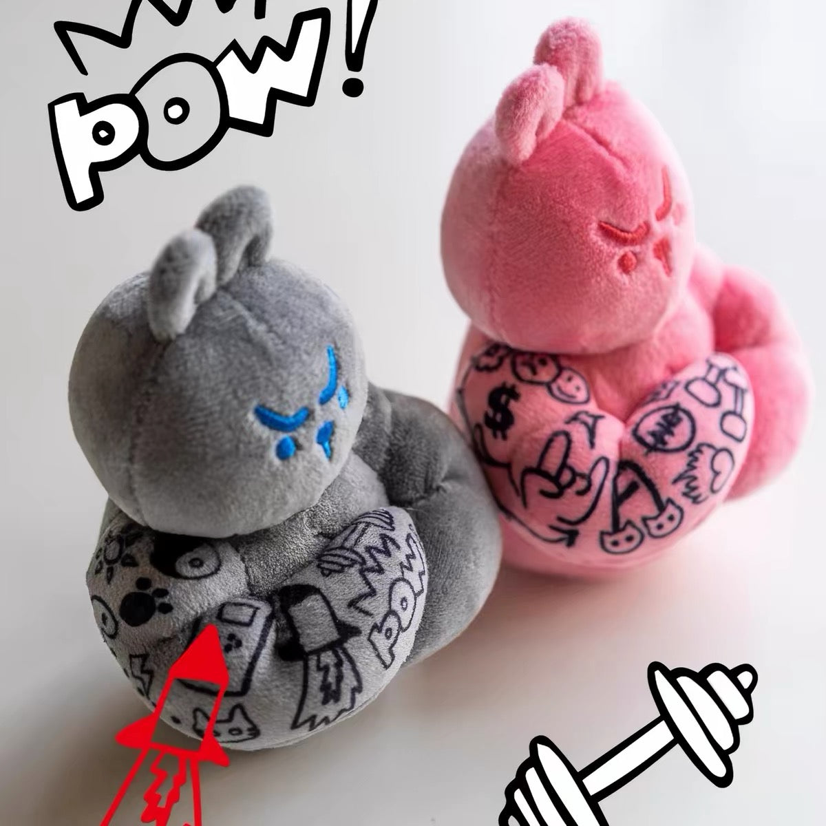 Grey and pink Muscle Rabbit Coach plush bag charms shown side by side