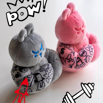 Grey and pink Muscle Rabbit Coach plush bag charms shown side by side