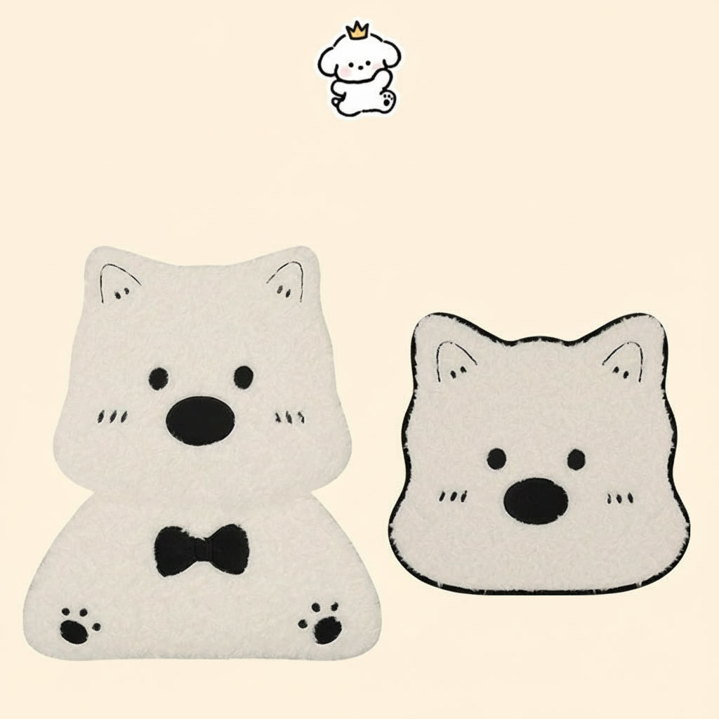 Two white cat-shaped cushions with black accents on a beige background.