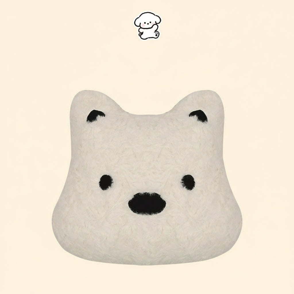 White pillow with black facial features on a beige background