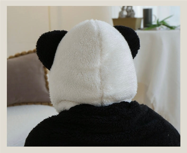 Person wearing a panda hat in a casual indoor setting