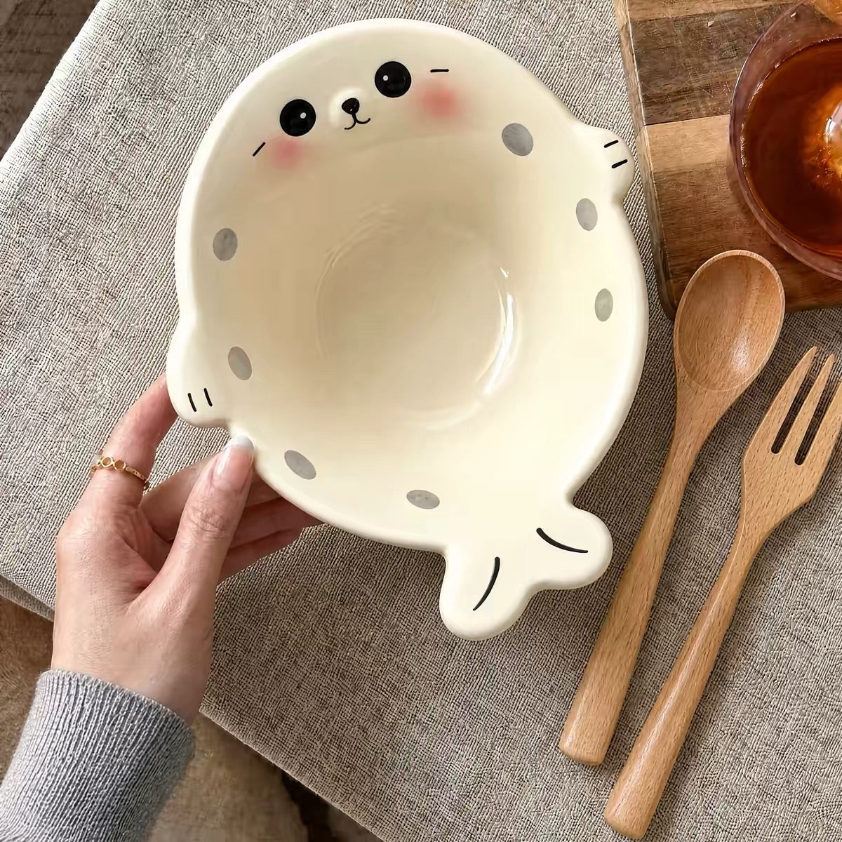 Cream Chubby Seal ceramic bowl with wooden spoon and fork