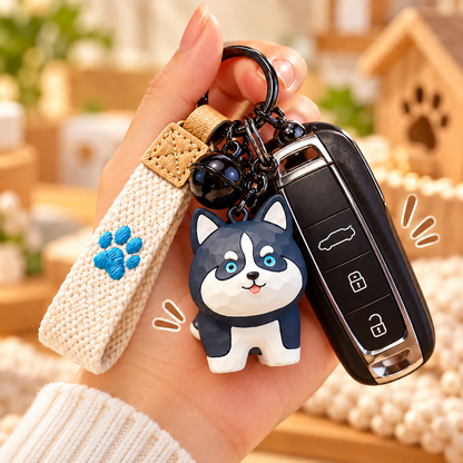 Husky dog resin keychain charm held with a car key for scale